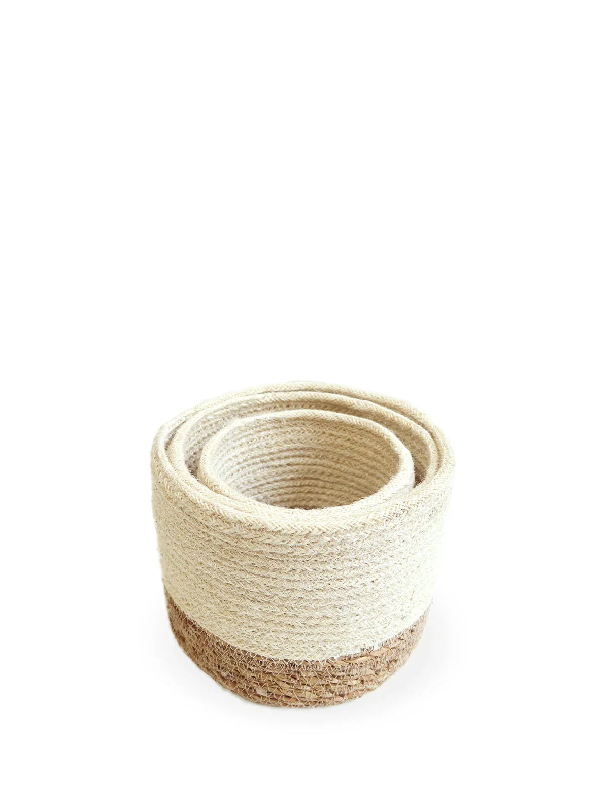 Set of three nested beige woven storage baskets with brown bases on white background